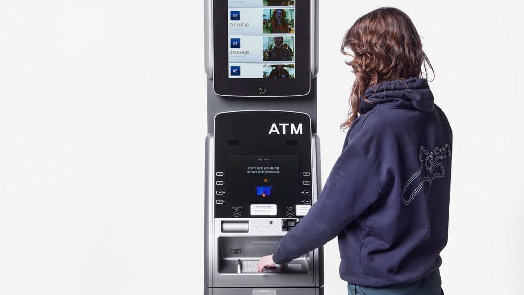 ATM At Art Basel Displays Your Bank Balance & Photo On A Leaderboard